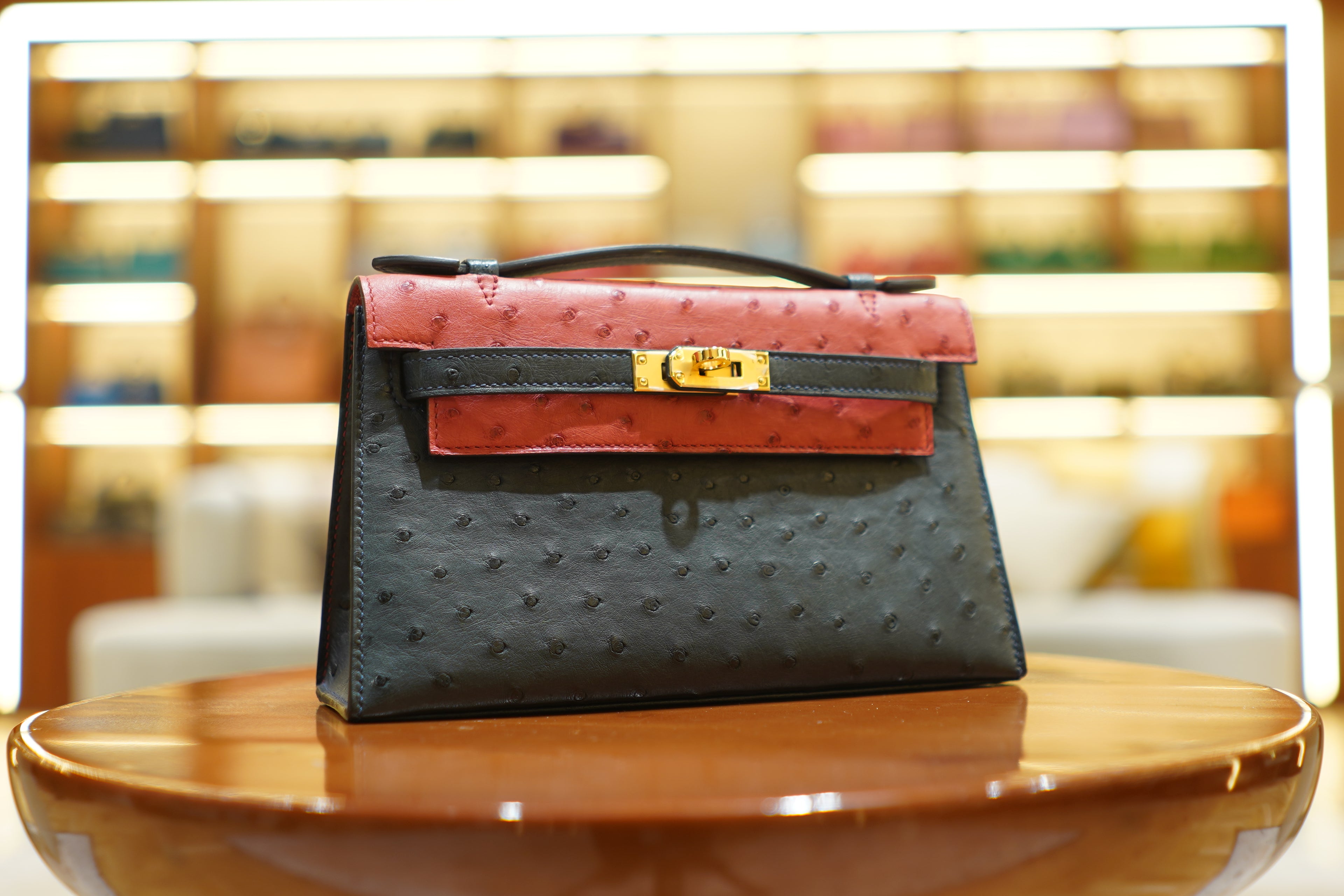 Hermes | Kelly Pochette – Ostrich Leather – Black & Red – Gold Hardware