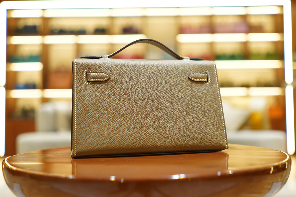 Hermès | Kelly Pochette – Epsom – Grigio – Finiture in Oro