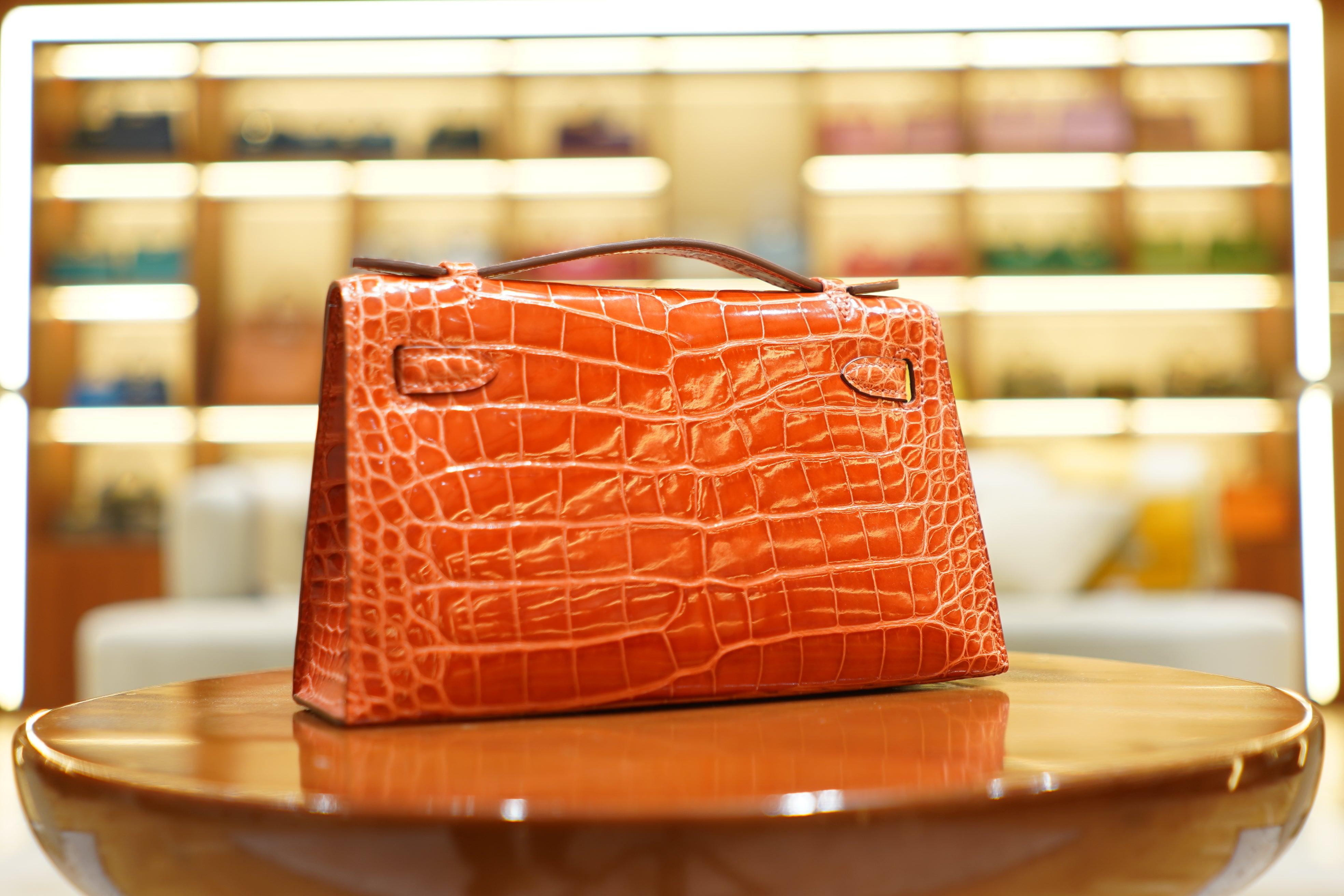 Hermes | Kelly Pochette – Shiny Crocodile Leather – Orange – Gold